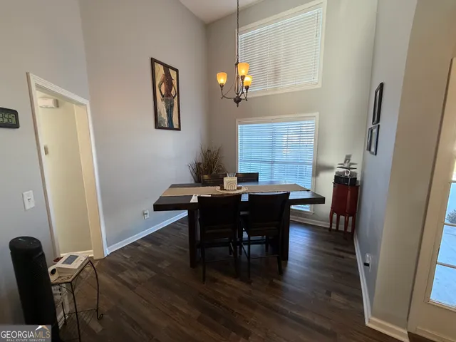 a kitchen with sink refrigerator and stove