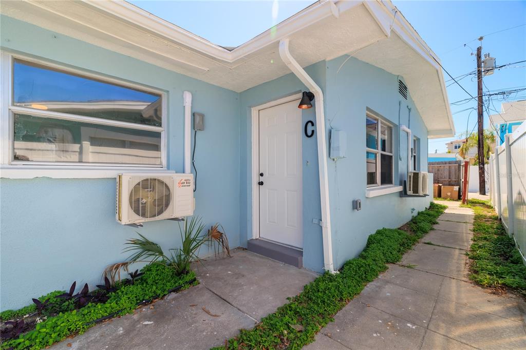 13388 1st Street East Madeira Beach, FL 33708 - Photo 17 of 28 a front view of a house with garden