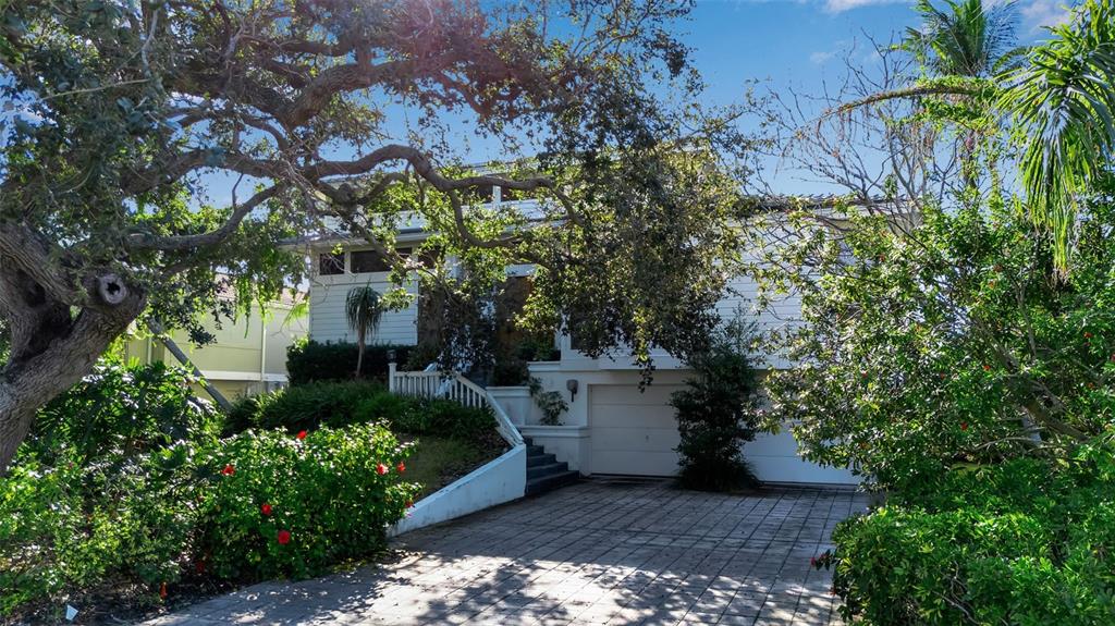 3361 Bayou Sound Longboat Key, FL 34228 - Photo 1 of 41 a view of a yard with plants and large trees