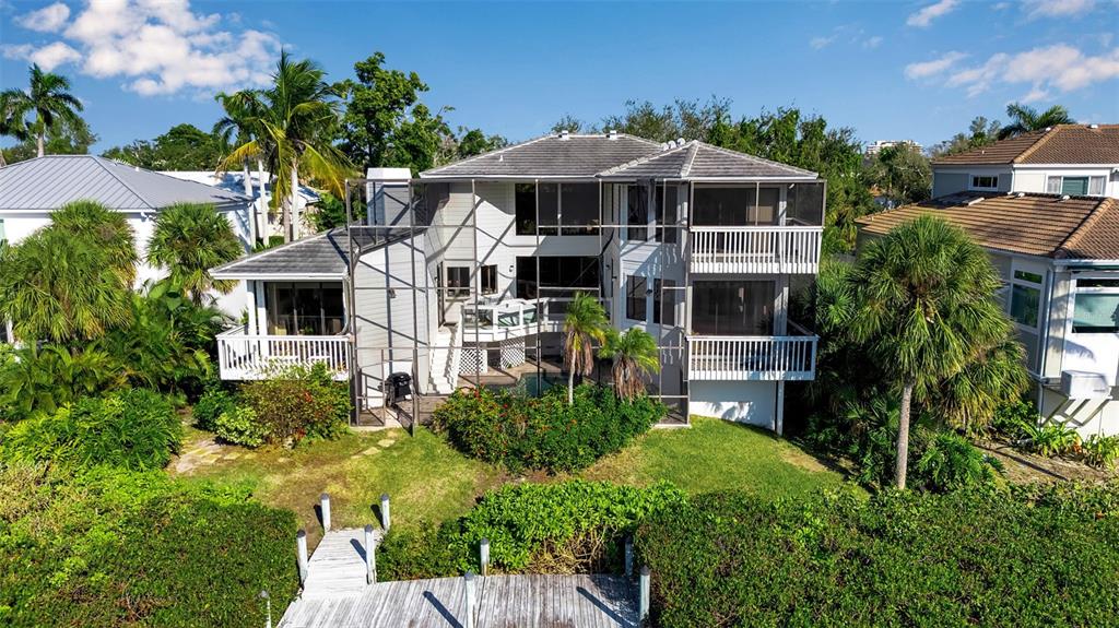 3361 Bayou Sound Longboat Key, FL 34228 - Photo 22 of 41 a front view of a house with a yard