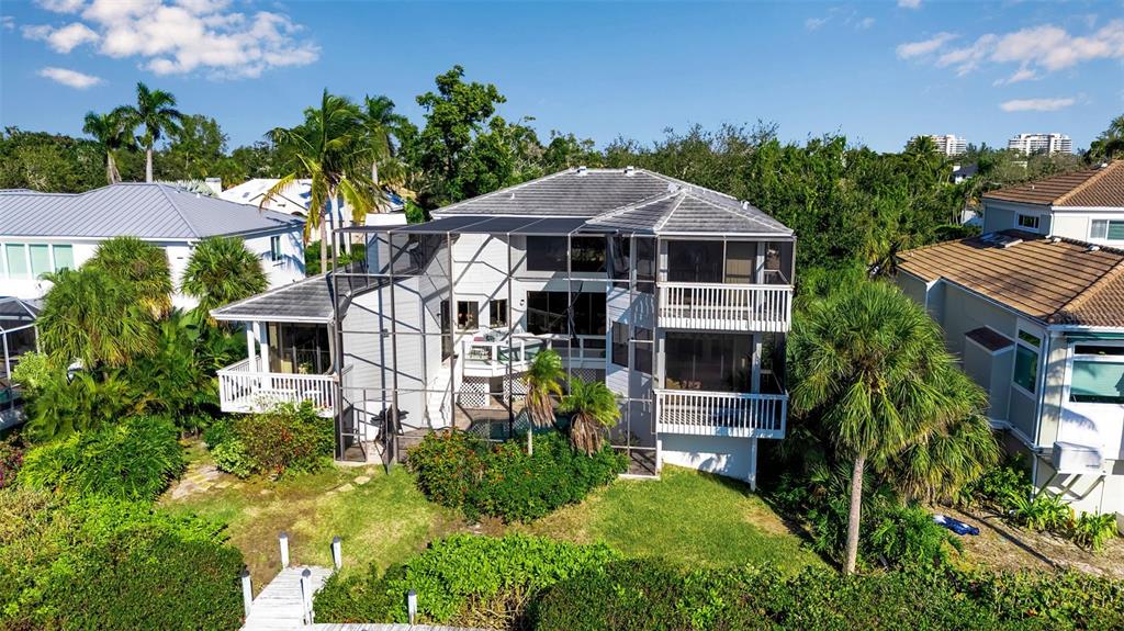 3361 Bayou Sound Longboat Key, FL 34228 - Photo 23 of 41 a front view of a house with yard and green space