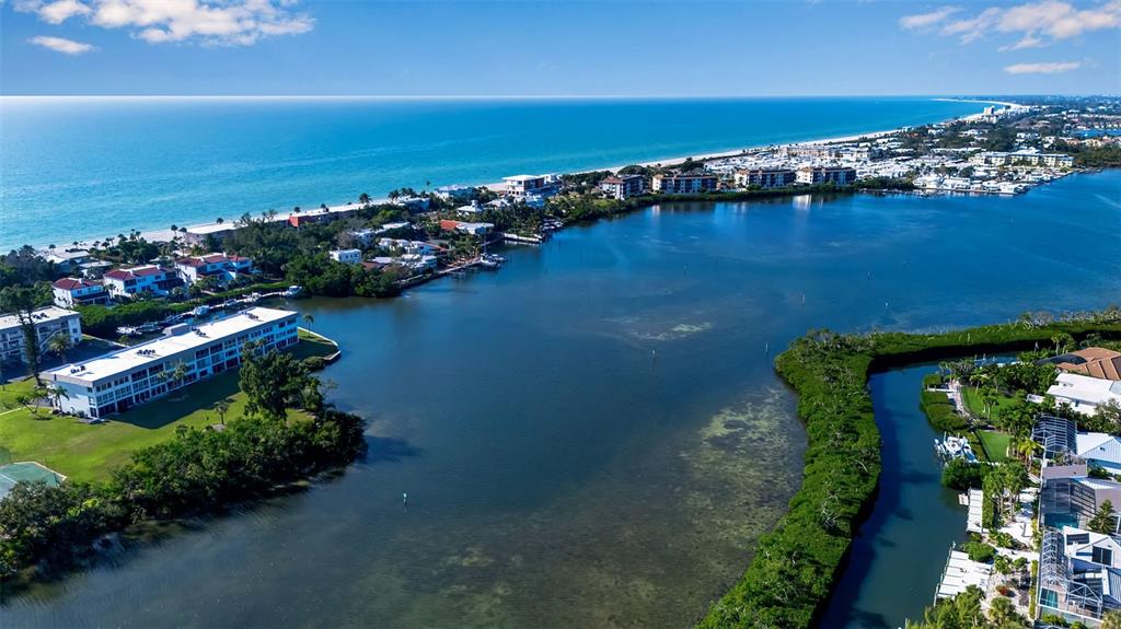 3361 Bayou Sound Longboat Key, FL 34228 - Photo 26 of 41 a view of a lake with a building in the background