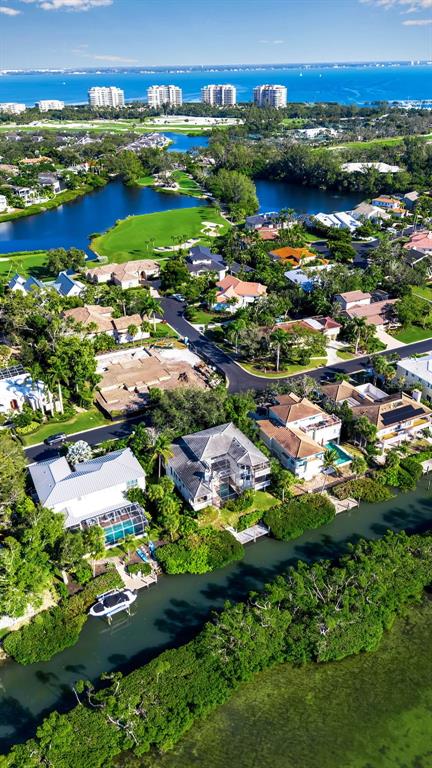 3361 Bayou Sound Longboat Key, FL 34228 - Photo 32 of 41 an aerial view of residential houses with outdoor space and lake view