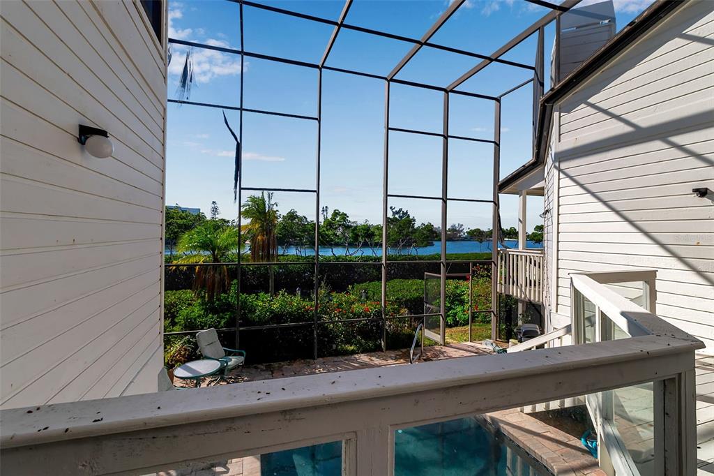 3361 Bayou Sound Longboat Key, FL 34228 - Photo 34 of 41 a table and chairs in front of a window