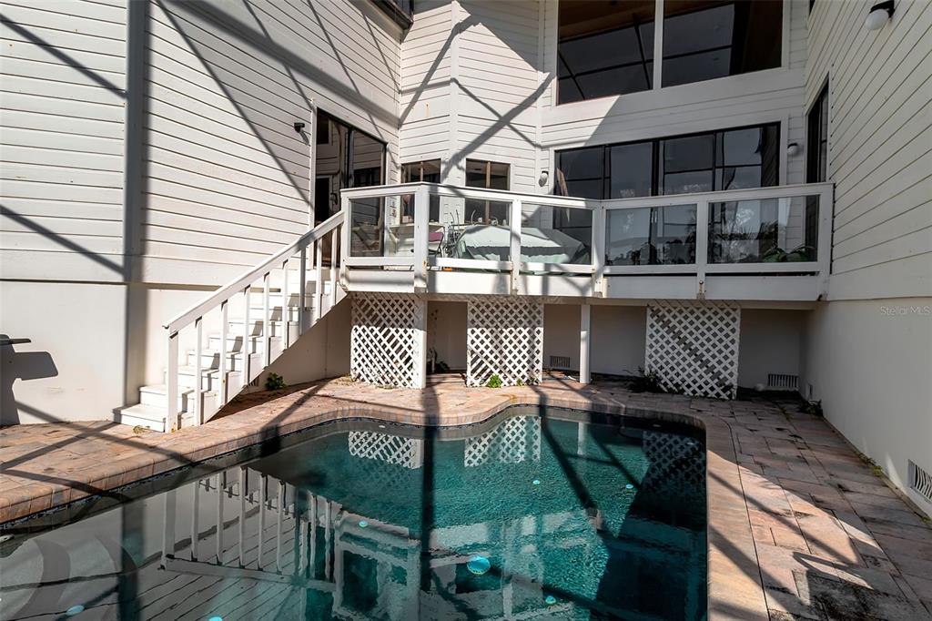 3361 Bayou Sound Longboat Key, FL 34228 - Photo 38 of 41 a roof deck with table and chairs