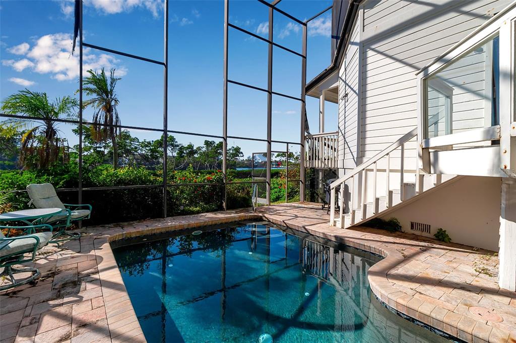 3361 Bayou Sound Longboat Key, FL 34228 - Photo 39 of 41 a view of balcony with two chairs and a potted plant