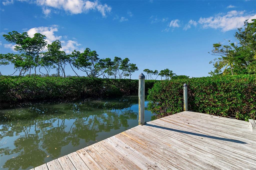 3361 Bayou Sound Longboat Key, FL 34228 - Photo 41 of 41 a view of a lake with a house in the background