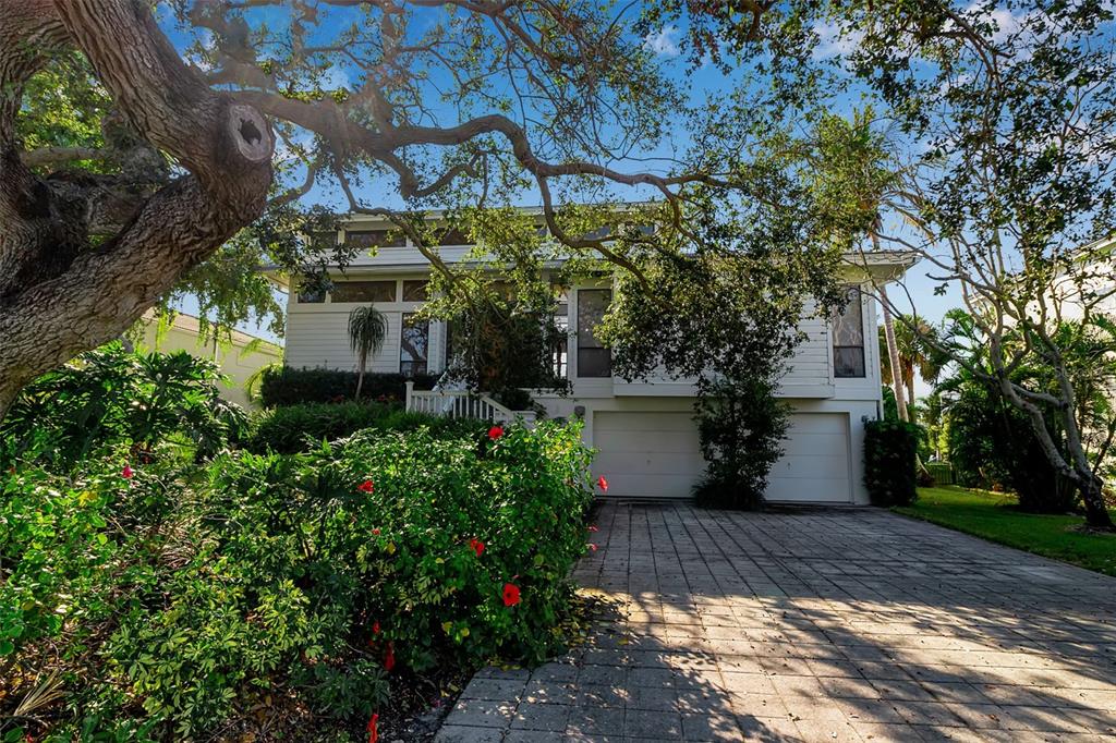 3361 Bayou Sound Longboat Key, FL 34228 - Photo 5 of 41 a view of a yard with plants and trees