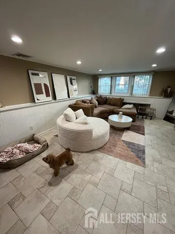 a living room with furniture and a table