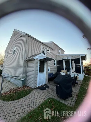 a view of a house with backyard and porch