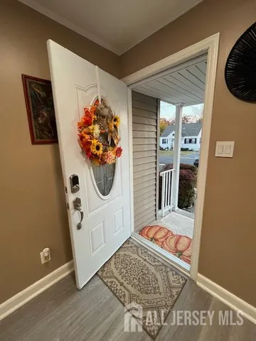 a view of a hallway with washer and dryer
