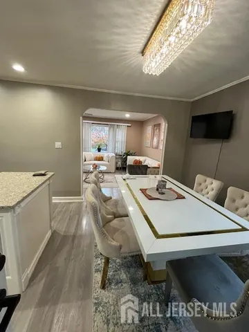 a kitchen with a stove a sink and a refrigerator