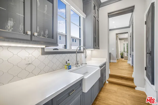 a kitchen with a sink and a window