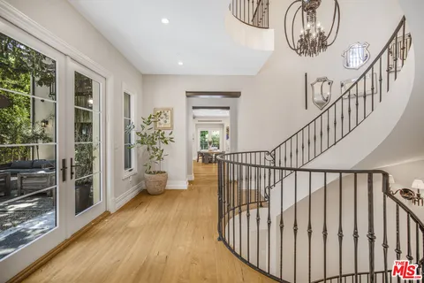 a view of entryway with wooden floor