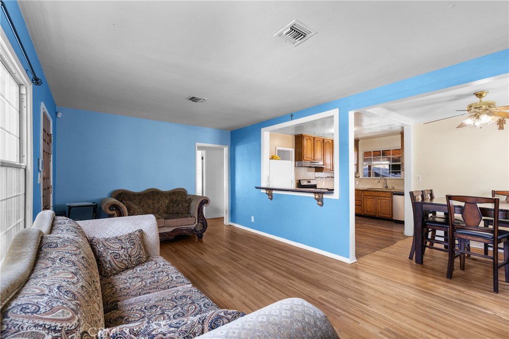 20006 Vanowen Street Winnetka, CA 91306 - Photo 5 of 29 Living room, dining room, kitchen.