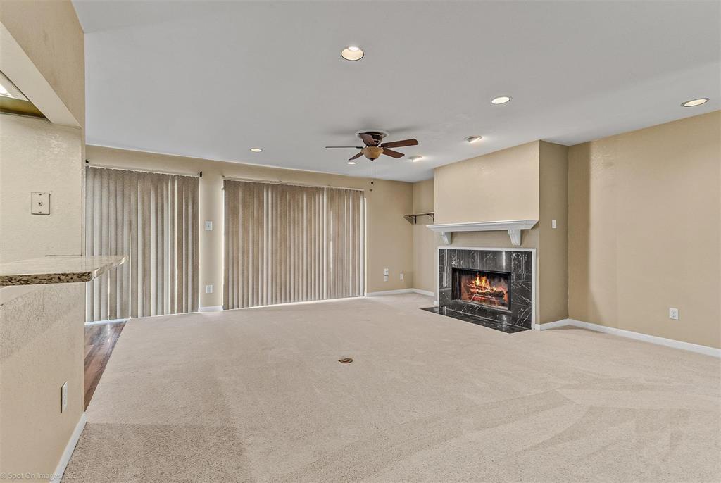 925 Signal Ridge Place Rockwall, TX 75032 - Photo 8 of 21 a view of an empty room with a fireplace