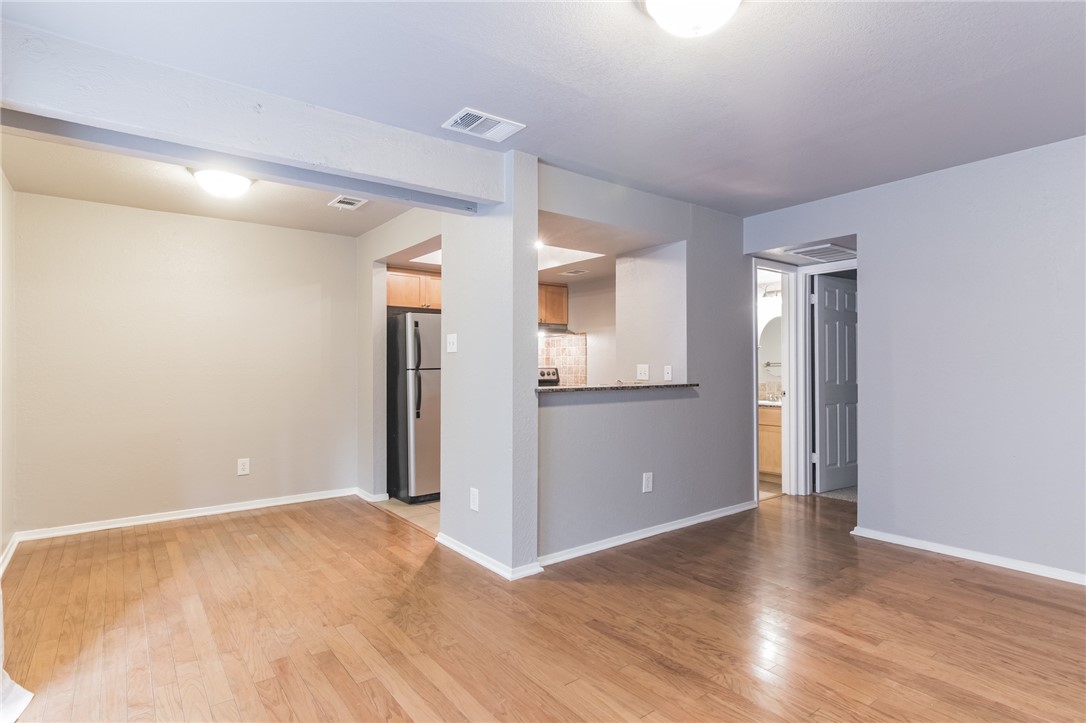 3627 Menchaca Road, Unit 112 Austin, TX 78704 - Photo 4 of 25 Dining room and kitchen taken from living room. Bathroom and bedroom are in the right background
'