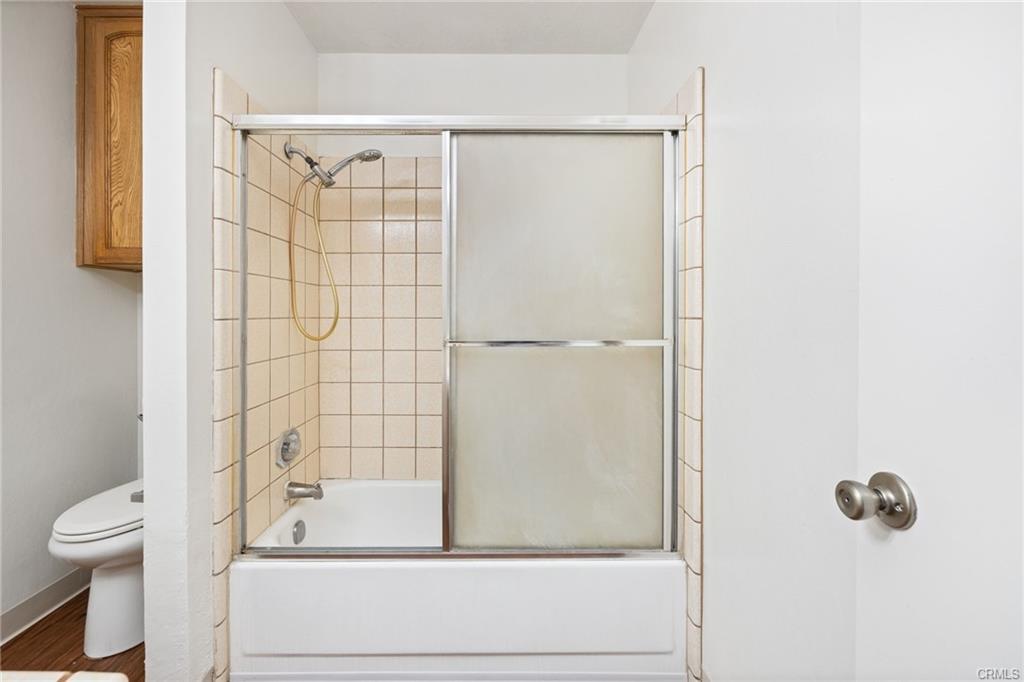 49400 River Park Road, Unit 17 Oakhurst, CA 93644 - Photo 22 of 34 a bathroom with a shower and a toilet
