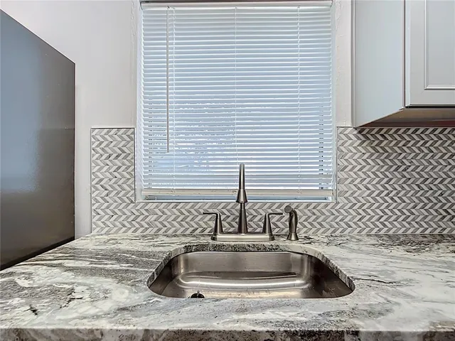 a bathroom with a sink and a bathtub