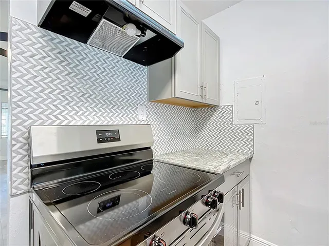 a close view of kitchen counter top space and appliances