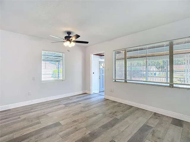 a view of an empty room with a window