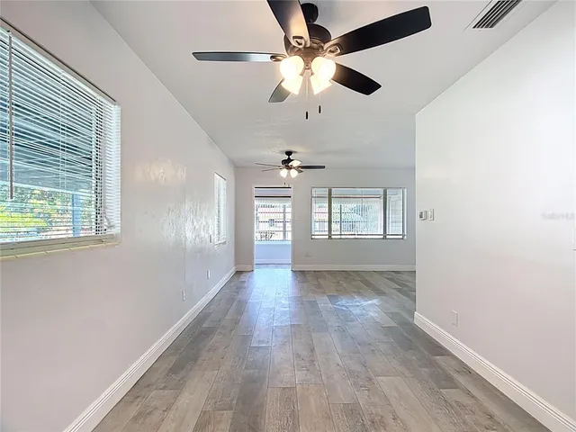 a view of an empty room with a window