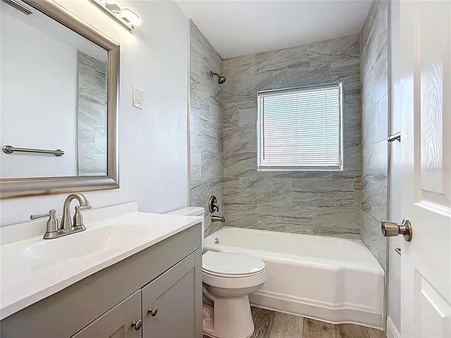 a bathroom with a sink a toilet and a bathtub