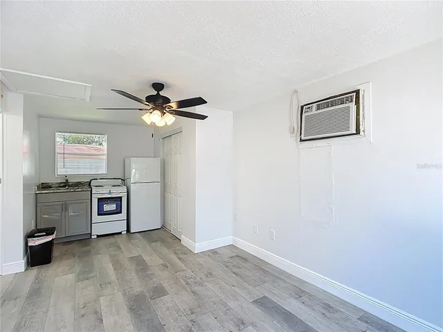 a view of a kitchen with a sink stove and a window