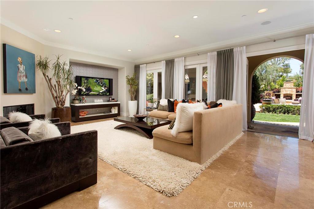 2395 Horizon Way Tustin, CA 92782 - Photo 12 of 43 a living room with furniture large window and a flat screen tv