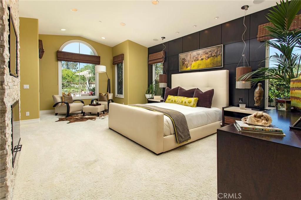 2395 Horizon Way Tustin, CA 92782 - Photo 20 of 43 a bedroom with a bed and large windows