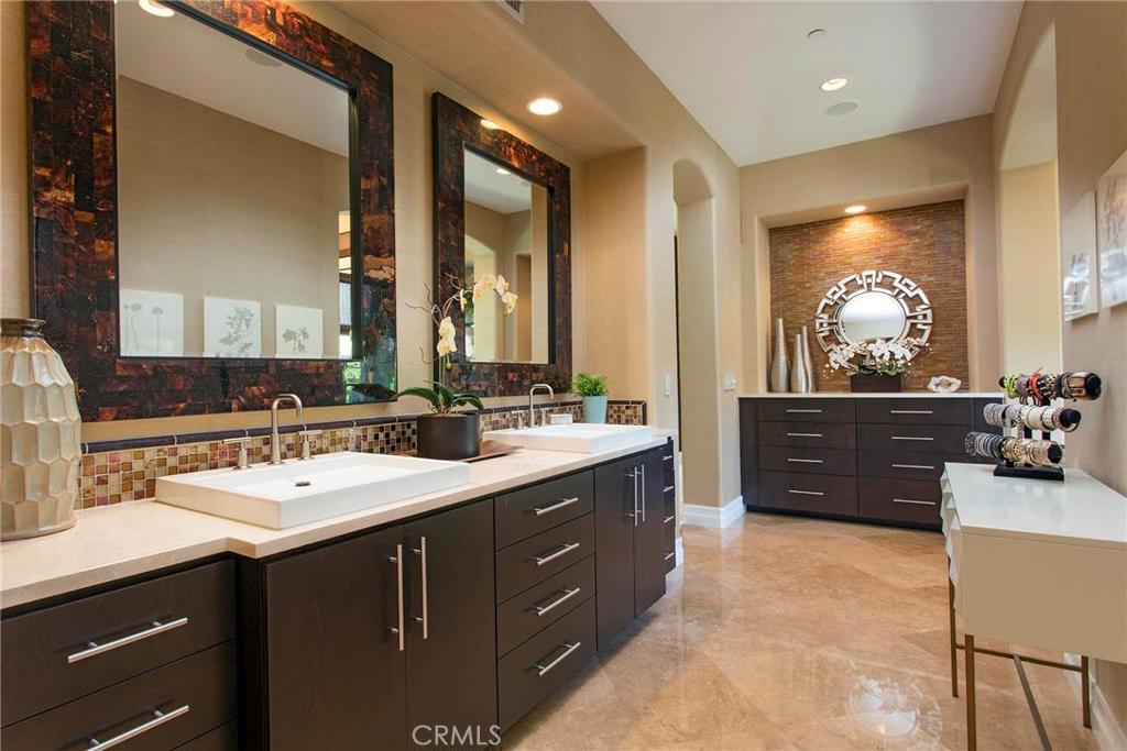 2395 Horizon Way Tustin, CA 92782 - Photo 23 of 43 a spacious bathroom with a double vanity sink and a mirror