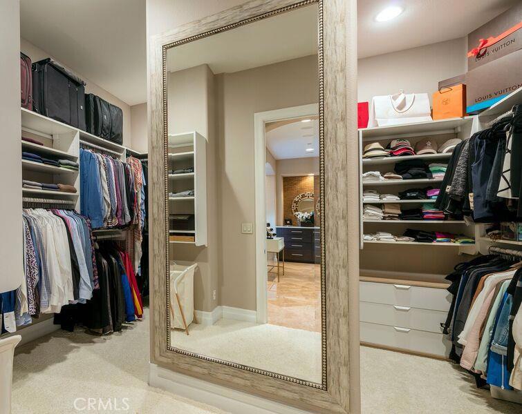 2395 Horizon Way Tustin, CA 92782 - Photo 26 of 43 a view of walk in closet with clothes and shoes