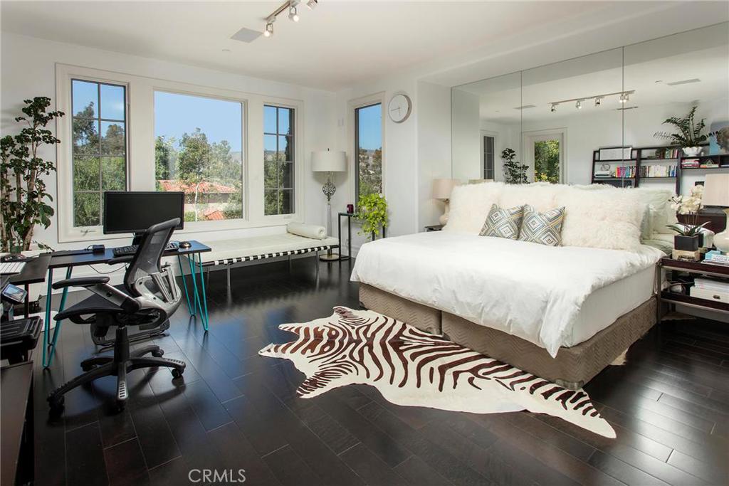 2395 Horizon Way Tustin, CA 92782 - Photo 36 of 43 a bedroom with a bed and large windows