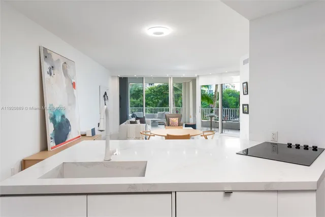a kitchen with a sink and a large window