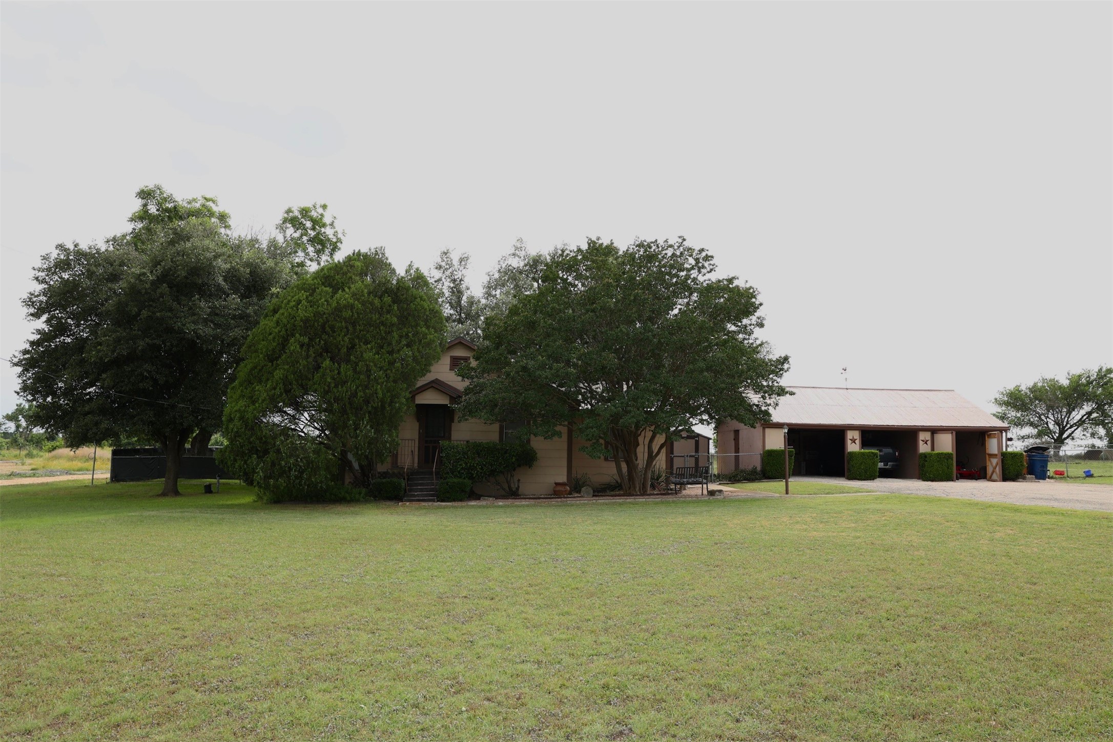 503 State Highway 95 Granger, TX 76530 - Photo 14 of 39 a house view with a garden space