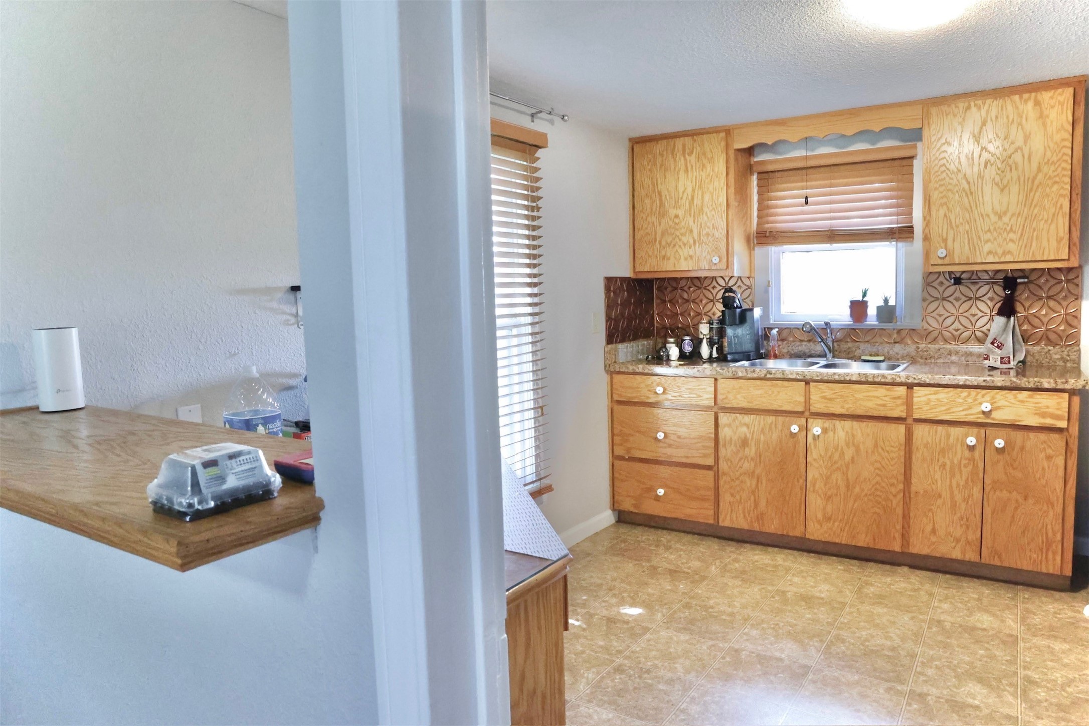 503 State Highway 95 Granger, TX 76530 - Photo 19 of 39 a kitchen with white cabinets and window
