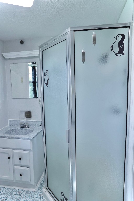 503 State Highway 95 Granger, TX 76530 - Photo 23 of 39 a bathroom with a granite countertop sink a mirror a vanity and a shower