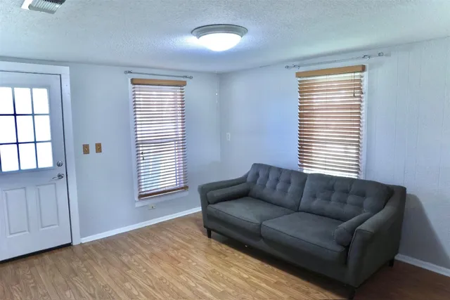 a view of house with a yard