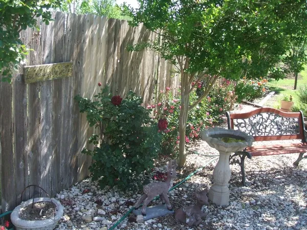 a view of a backyard with sitting area