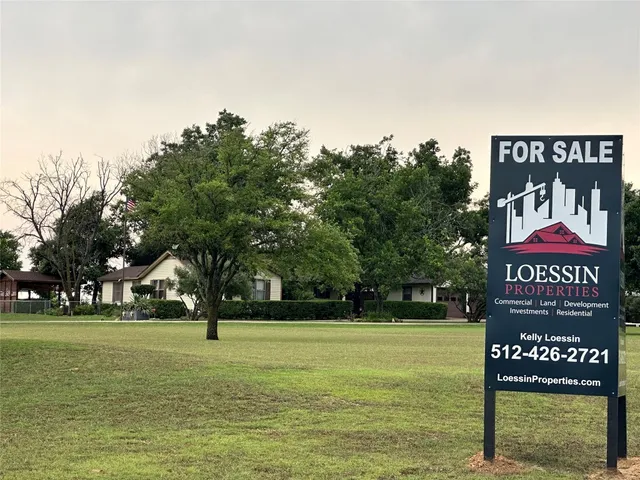 a room with wooden floor and glass door