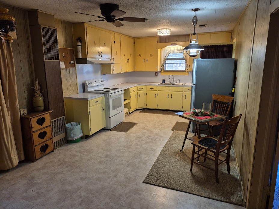503 State Highway 95 Granger, TX 76530 - Photo 36 of 39 a kitchen with a refrigerator a sink and a stove