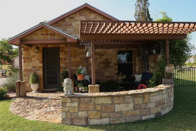 a backyard of a house with outdoor seating
