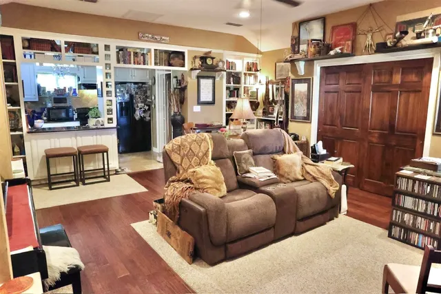 a kitchen with stainless steel appliances granite countertop a stove a cabinets and a refrigerator