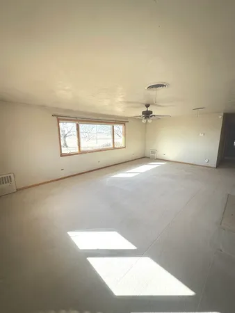 a kitchen with wooden floors and a stove top oven