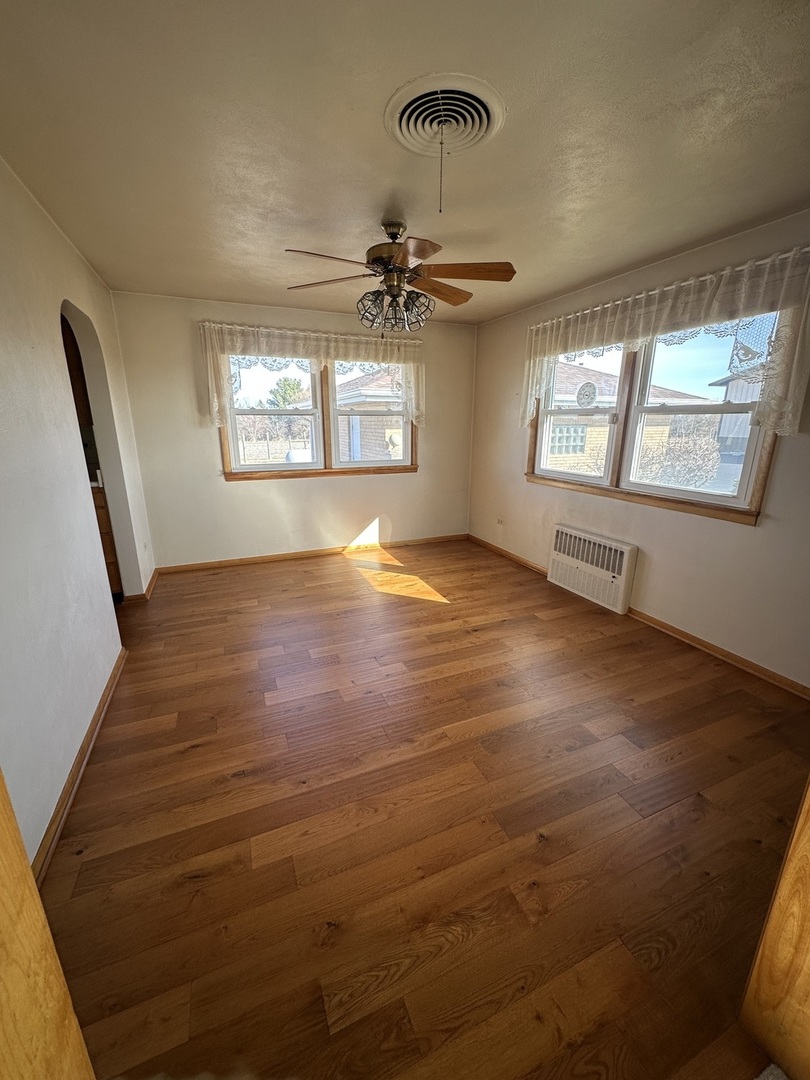 29428 East 500 North Road Le Roy, IL 61752 - Photo 16 of 79 wooden floor in an empty room with a window