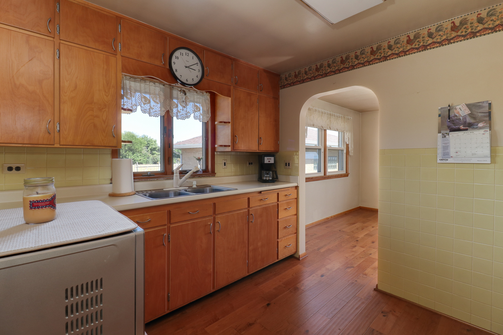 29428 East 500 North Road Le Roy, IL 61752 - Photo 18 of 79 a kitchen with cabinets a window and stainless steel appliances