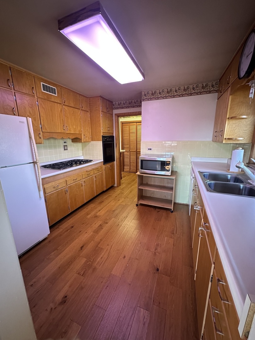 29428 East 500 North Road Le Roy, IL 61752 - Photo 22 of 79 a kitchen with sink microwave and stove