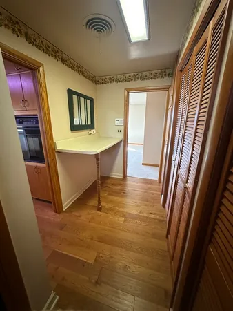 en empty room with a ceiling fan and window