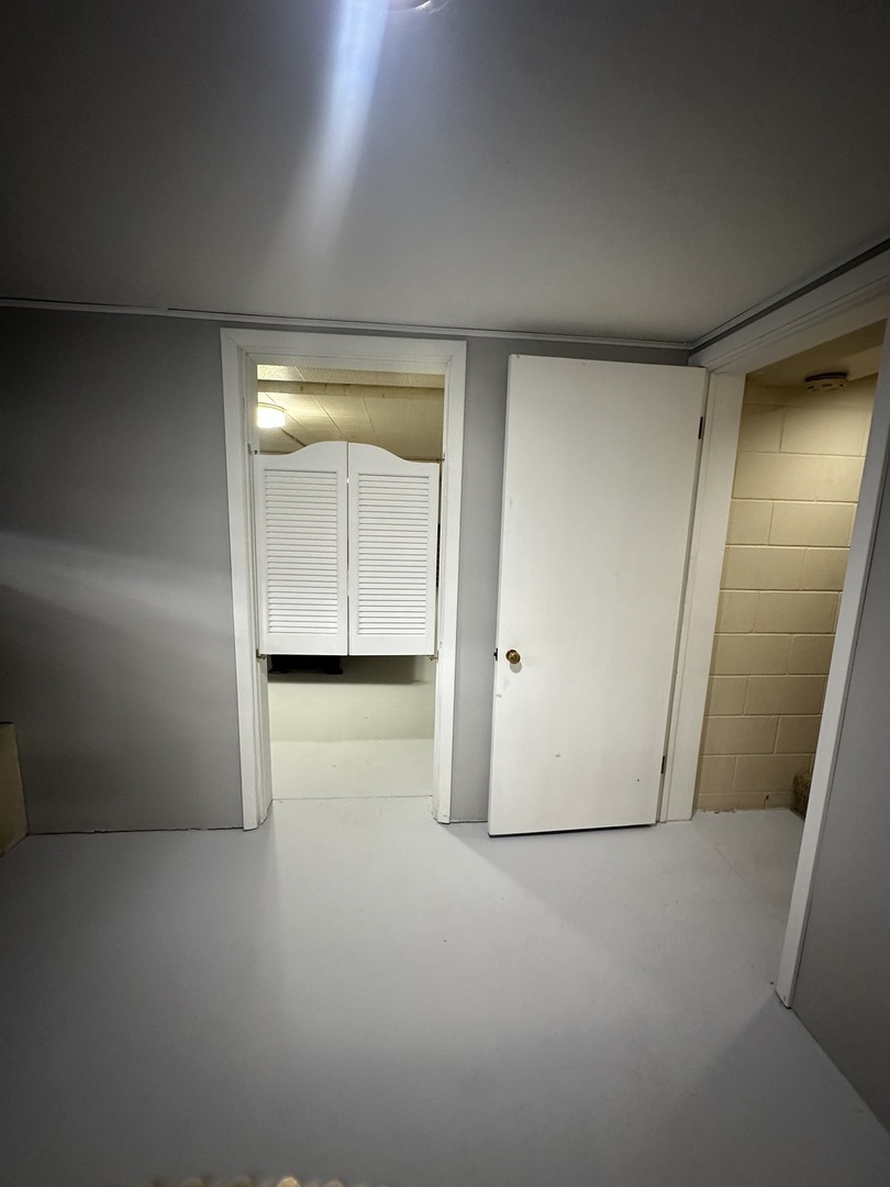 29428 East 500 North Road Le Roy, IL 61752 - Photo 44 of 79 an empty room with wooden floor and cabinet