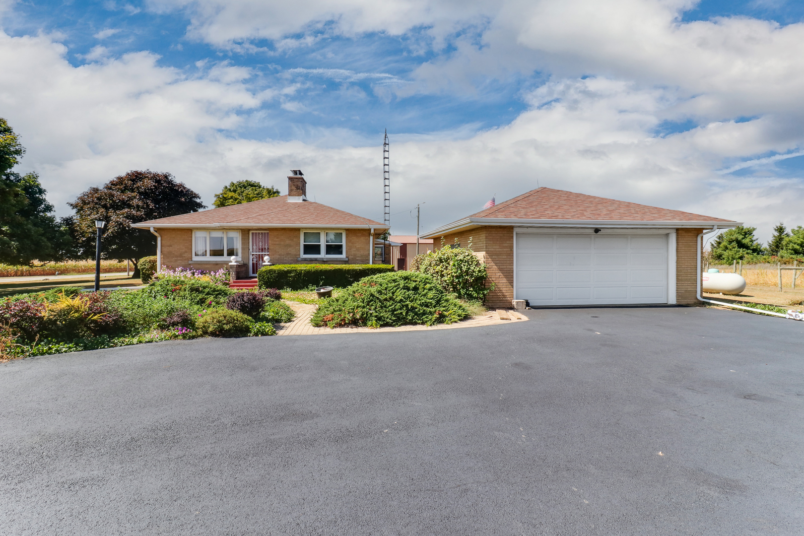 29428 East 500 North Road Le Roy, IL 61752 - Photo 62 of 79 a front view of a house with a yard and garage